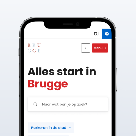 A mobile phone displaying the mobile version of the City of Bruges' new website, optimized for accessibility.